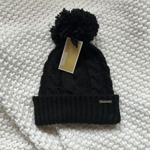 Michael Kors black knit winter hat! This hat has a poof on the top!